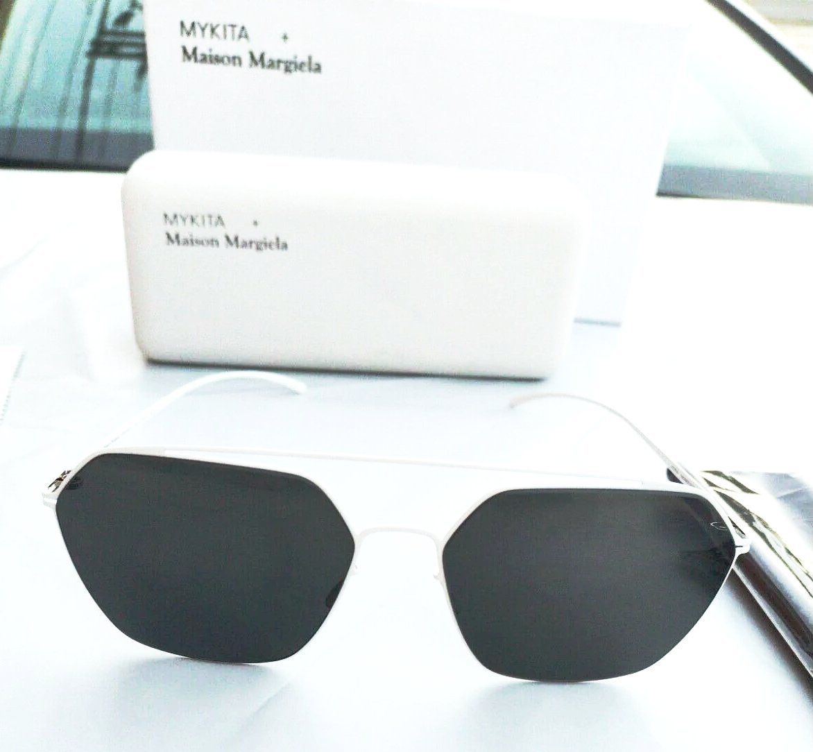 Mykita + Maison Margiela sunglasses white frame grey lenses