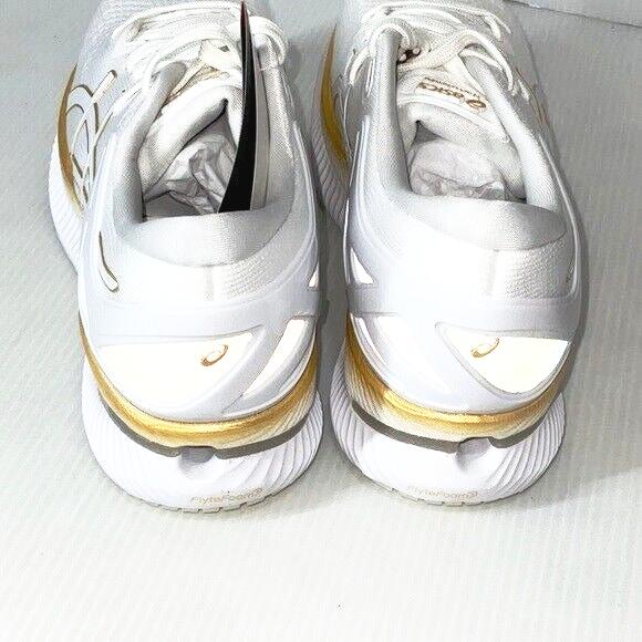 Woman’s Asics MetaRide white/pure gold running shoes size 9.5 US - Classic Fashion Deals
